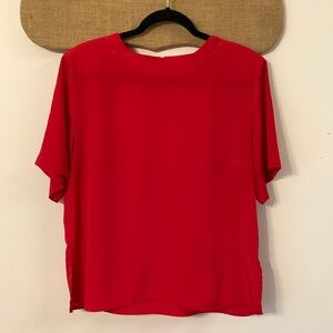 Cute red blouse. Never worn size M